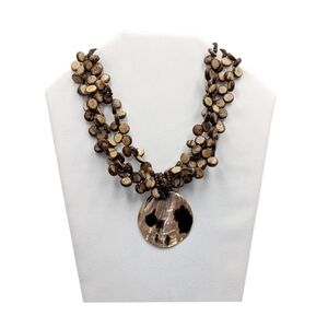 👣4/$20.  Elegant Brown Beaded Necklace with Shell Pendant. NWOT